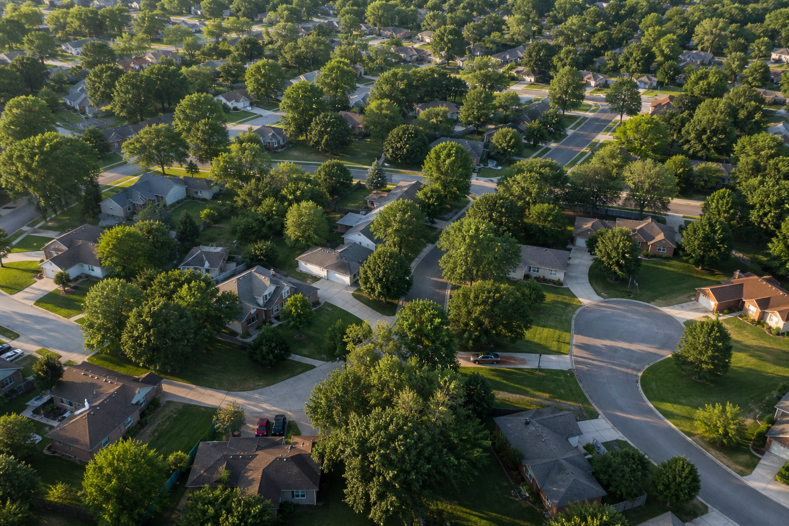 Aerial view of a tree-lined Overland Park, Kansas neighborhood